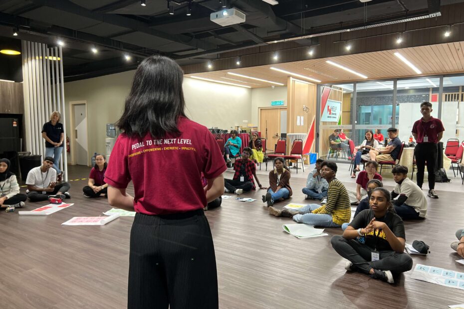 A facilitator is giving instructions to participants